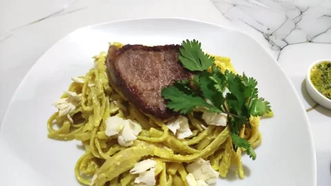Serving of "Pasta a la Huancaina". Typical food in Peru. Stockbeeldmateriaal 285361458