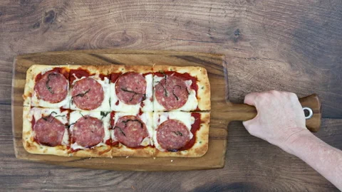 Serving a Pepperoni Flatbread Pizza Stock Footage 162736536
