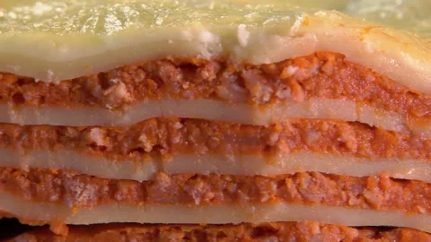 Serving a perfect slice of delicious layered lasagna Stock Footage 315703078