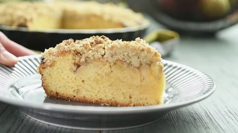 Serving a piece of apple crumble cake. Stock Footage 202176791