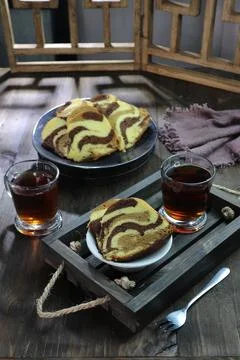 Serving pieces of marble cake Stock Photos