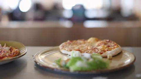 Serving a Pizza onto a Plate Stock Footage 77225722