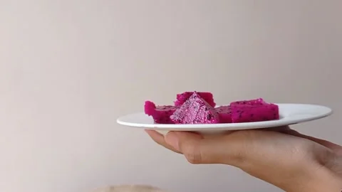 Serving a plate of dragon fruit with a white background Stock Footage 150522922
