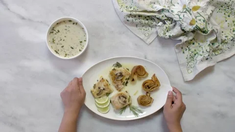 Serving a plate of roasted fillet fish with mushroom, mediterranean cuisine Stock Footage 135067071