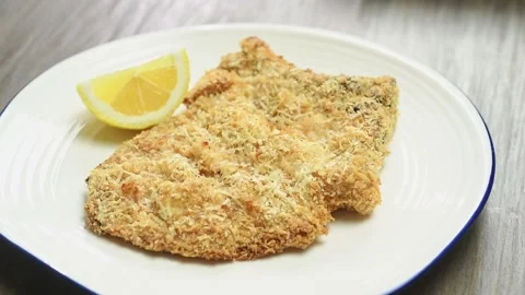 Serving pork chop milanese on the table. Stock Footage 195531043