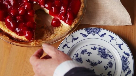 Serving a portion of cherry cream cheese pie Stock Footage 99411843