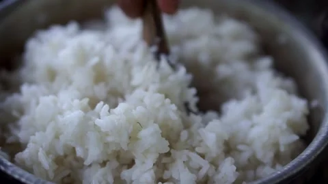 Serving process of a staple Asian food featuring fluffy detail and natural Video stock 328052072