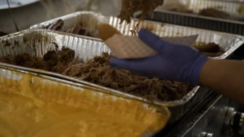 Serving pulled pork and mac and cheese at the 50th Anniversary Dogwood Stock Footage 276836062