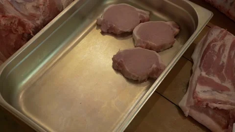 Serving Raw Pork Slices in the Metal Bowl Stock Footage 137900337