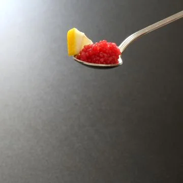 Serving red lumpfish eggs Stock Photos