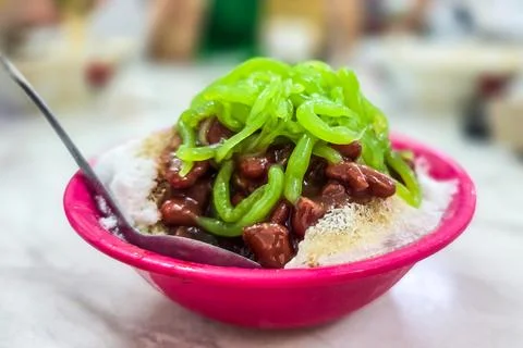 A serving of refreshing cendol with red beans with shaved ice and coconut milk Stock Photos