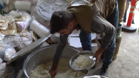 Serving Rice from a Huge Vat co Stock Footage 120933129