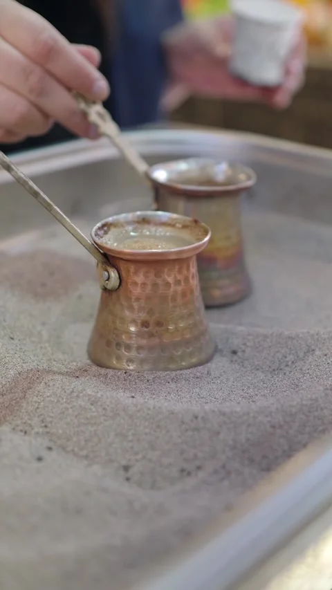 Serving rich turkish coffee at a lively market Stock Footage 339048214