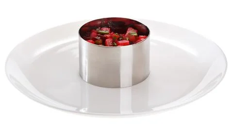 The serving ring is prepared on a serving plate. isolated on white background Stock Photos