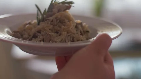 Serving the risotto with veal fillet. Stock Footage 106935683