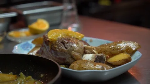 Serving roast pork leg with potatoes Stock Footage 98241250