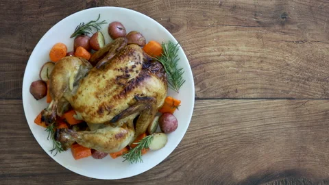 Serving Roasted Chicken and Root Vegetables Stock Footage 162200490