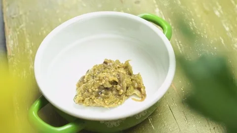 Serving roasted eggplant and green pepper dip. Stock Footage 169798417