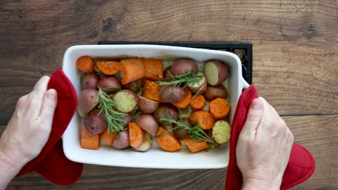 Serving Roasted Root Vegetables Stock Footage 162200641