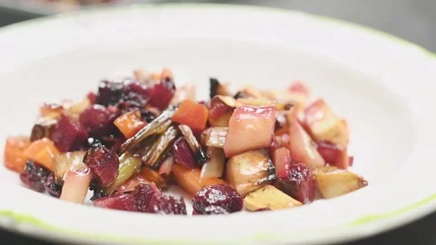 Serving roasted root vegetables salad. Stock Footage 159908483