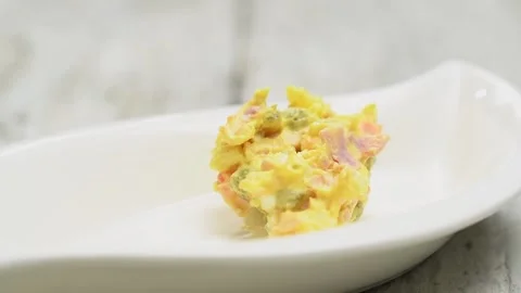 Serving of russian salad, in a plate. Stock Footage 159908710