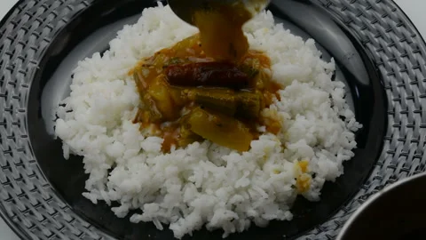 Serving sambar with white rice 動画素材 155303256
