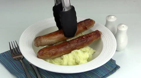 Serving Sausages On Mashed Potato Stock Footage 66421521