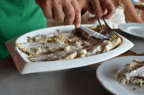 Serving a sea fish Stock Photos