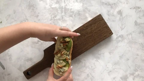 Serving a Set of delicious bruschetta on a cutting Board Stock Footage 129180323