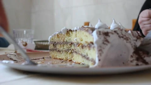 Serving a slice of Birthday cake on plate close up Vidéo 333016265