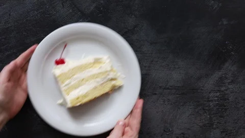 Serving a Slice of Coconut Cake with Space for Copy Stock Footage 296170923