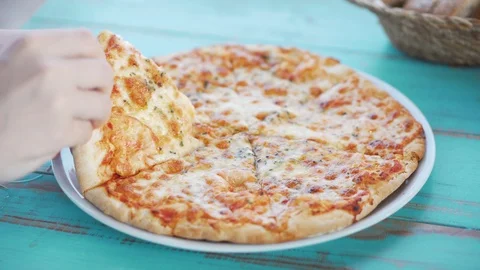 Serving slice of pizza from plate Stock Footage 125717395