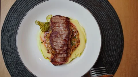 Serving Sliced Beef Steak on Mashed Potatoes Stock Footage 336726832