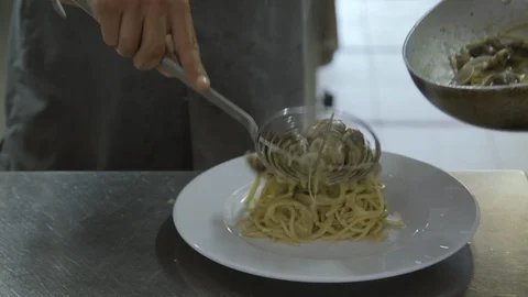 Serving spaghetti with clams Stock Footage 86203640