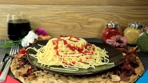 Serving spaghetti with ketchup sauce on plate Stock Footage 81663867