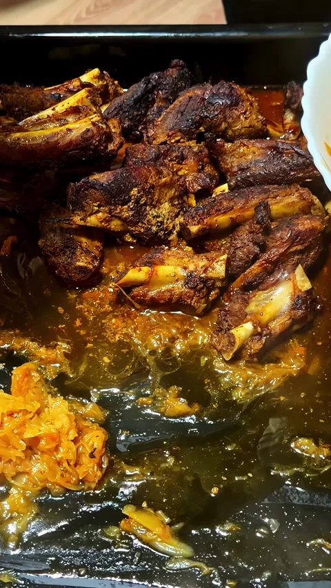 Serving Spiced Cooked Beef Ribs with Pickled Vegetables on Tray Video stock 339036423