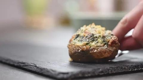 Serving spinach and cheese stuffed mushroom. Stock Footage 152530104