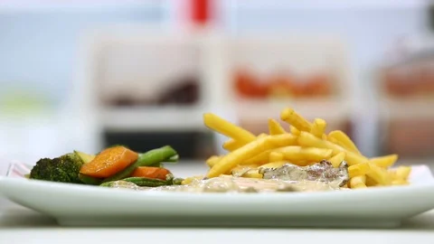 Serving steak plate with vegetables, potato and sauce Stock Footage 122065626