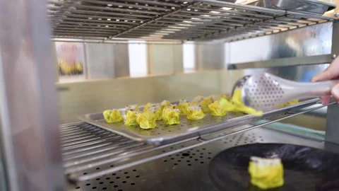 Serving Steamed Dim Sum Siu Mai Dumplings at a Buffet Stock Footage 334091996