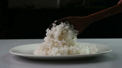 Serving steamed white rice Stockbeeldmateriaal 233425752