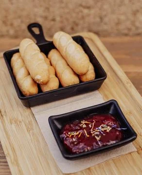 Serving of sticks stuffed with cheese called tequeños Stock Photos