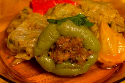 Serving stuffed peppers and cabbage leaves. Stock Photos