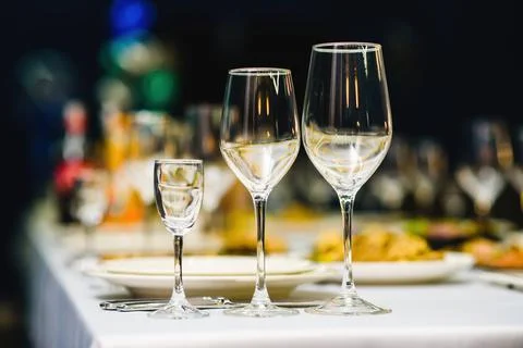 Serving on the table, crystal glasses for wine. Shallow depth of field. Stock Photos