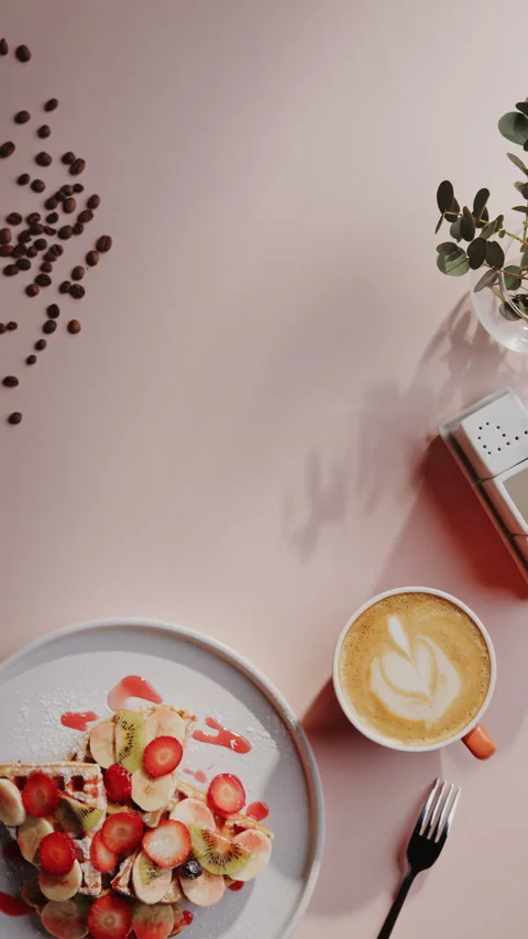 Serving tasty breakfast dessert dish with hot viennese waffles with friuts by Stock Footage 156865128