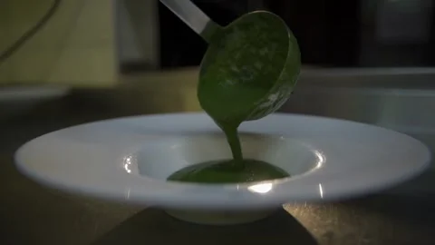 Serving a tasty creamy spinach soup Video stock 303554792