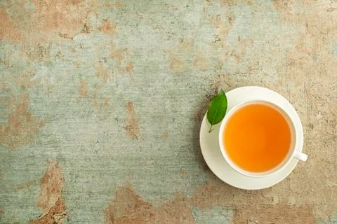 Serving Tea cup with fresh leaf Stock Photos