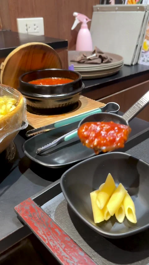 Serving Tomato Sauce Over Penne Pasta at a Buffet Stock Footage 340869264
