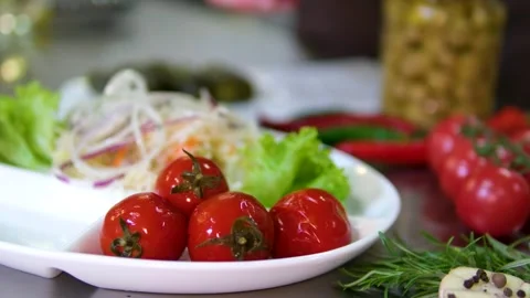 Serving of traditional fermented vegetables pickled tomatoes cucumbers and Stock Footage 319186633