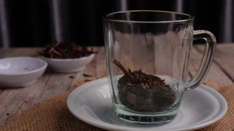 Serving Traditional Hot Tea in Clear Glass Cup on White Saucer Stock Footage 266971266