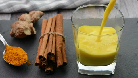 Serving turmeric milk also called as Golden Milk 動画素材 156243907